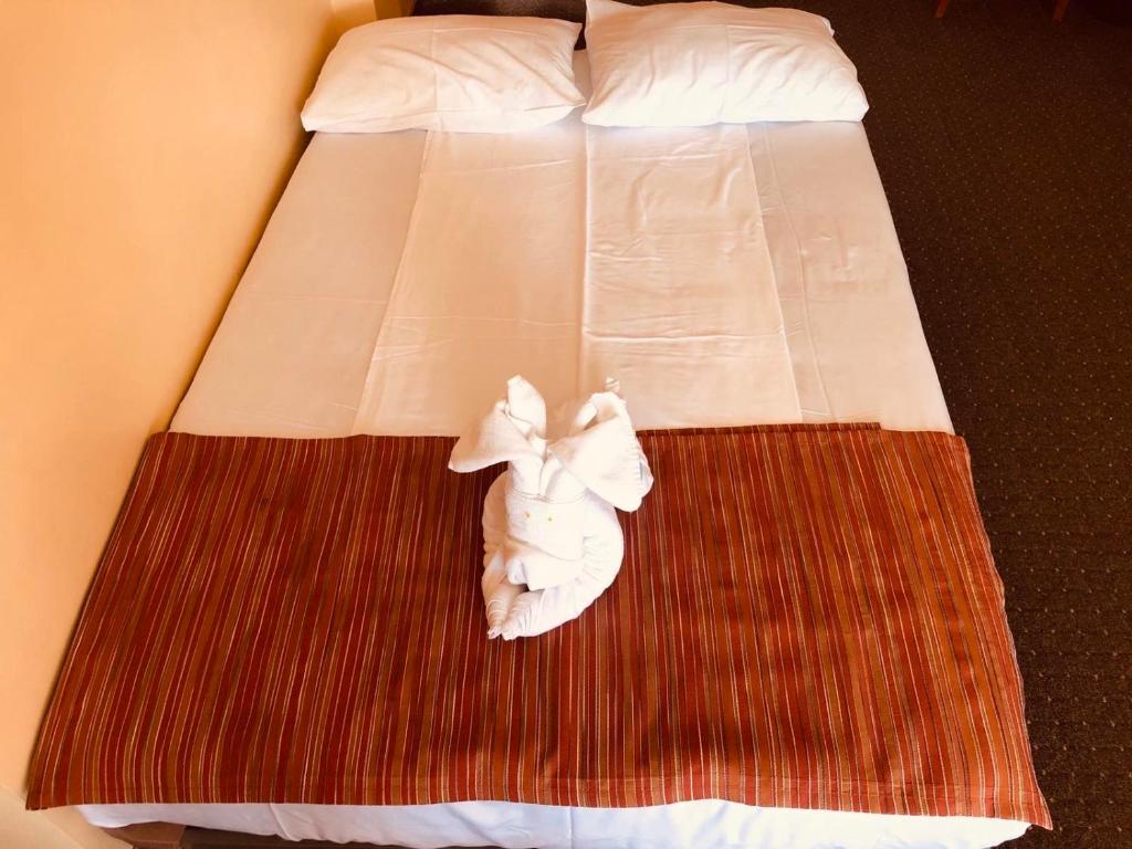 Postel nebo postele na pokoji v ubytování Family Hotel Deja Vu