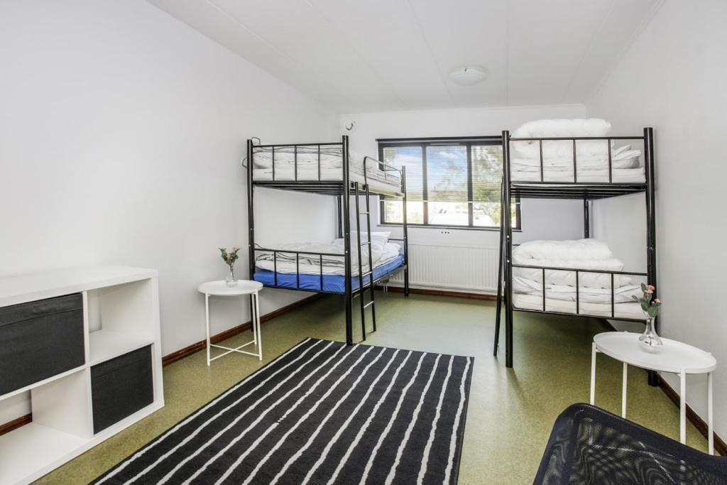 Postel nebo postele na pokoji v ubytování Hestra Guesthouse