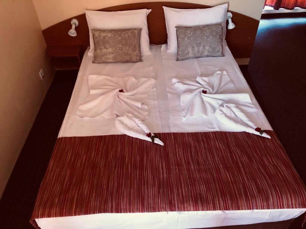 Postel nebo postele na pokoji v ubytování Family Hotel Deja Vu