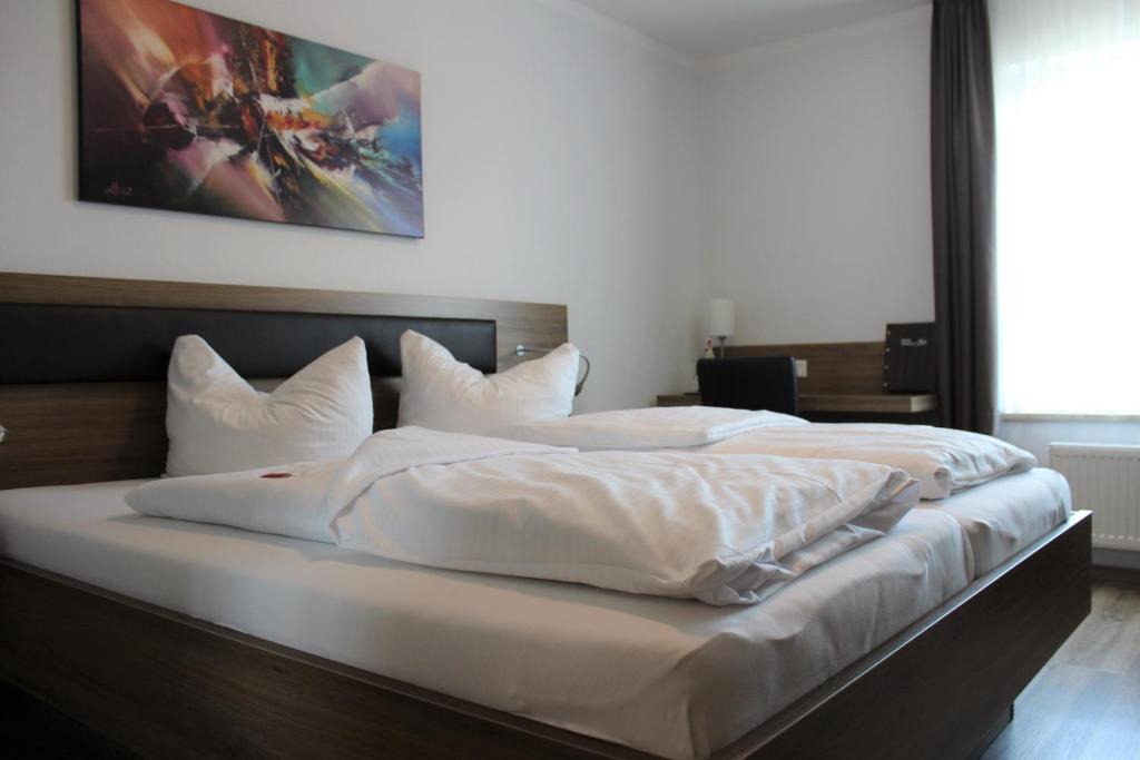 Postel nebo postele na pokoji v ubytování Hotel Alex