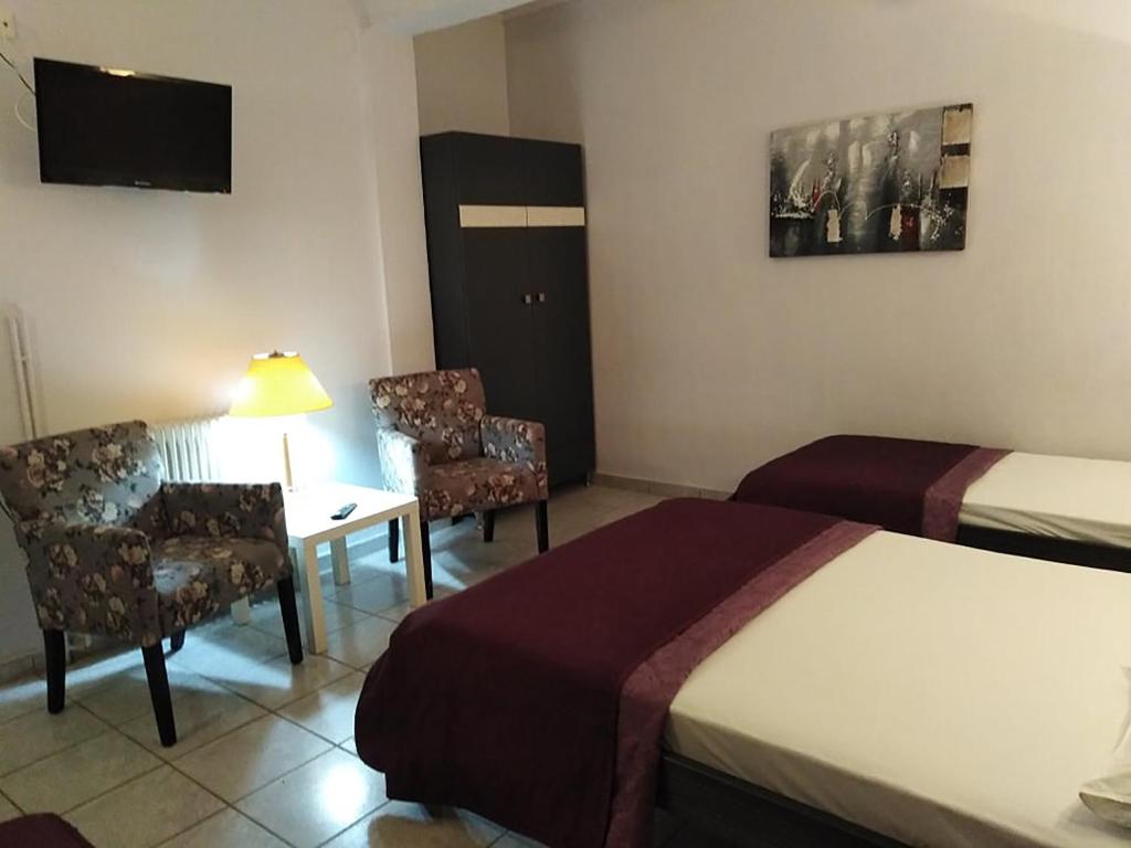 Postel nebo postele na pokoji v ubytování Villa Niki