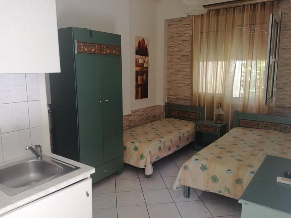 Postel nebo postele na pokoji v ubytování Villa Niki