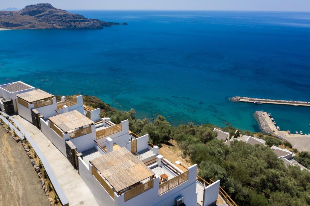 an aerial view of a villa with the sea in the background at Pyrgos Exclusive in Sellía