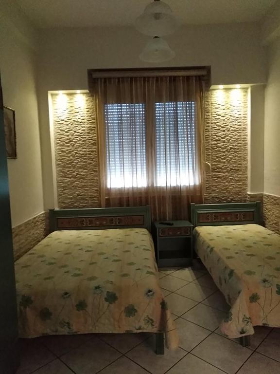 Postel nebo postele na pokoji v ubytování Villa Niki