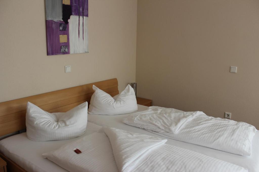 Postel nebo postele na pokoji v ubytování Hotel Alex