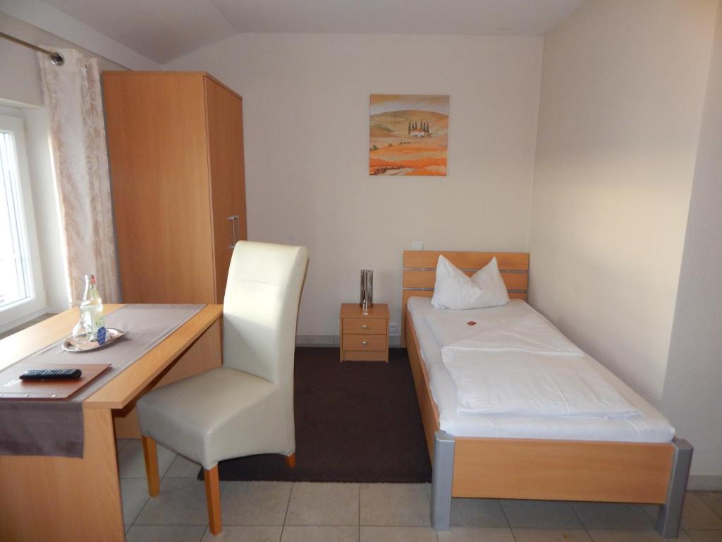 Postel nebo postele na pokoji v ubytování Hotel Alex
