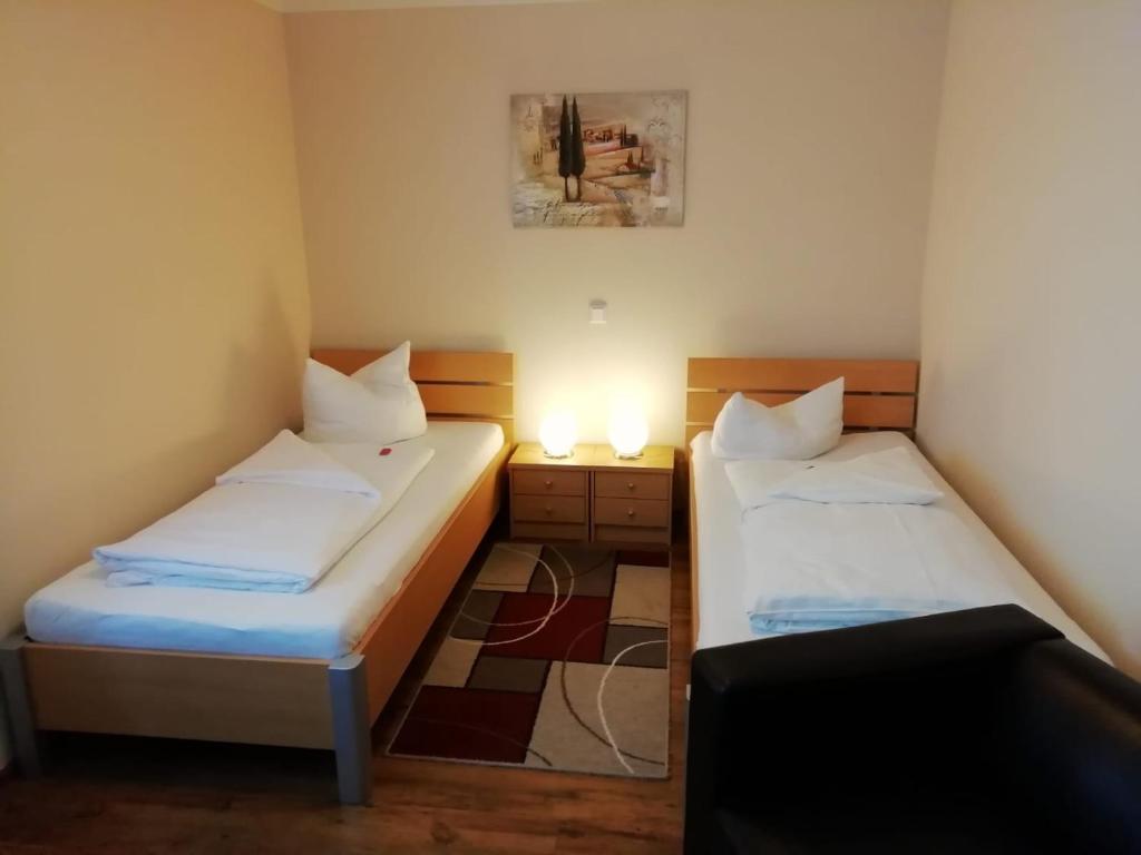 Postel nebo postele na pokoji v ubytování Hotel Alex