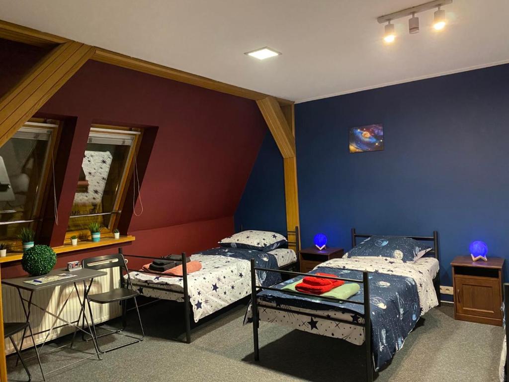 Posteľ alebo postele v izbe v ubytovaní Hostel Galaxy