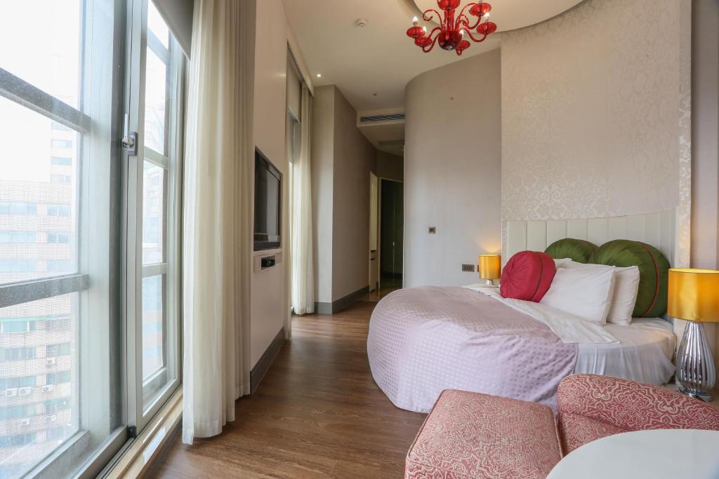 Postel nebo postele na pokoji v ubytování City Suites - Taipei Nandong