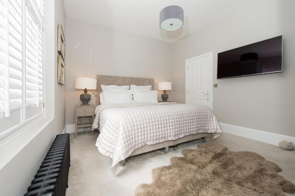 Katil atau katil-katil dalam bilik di Harrogate Serviced Apartments