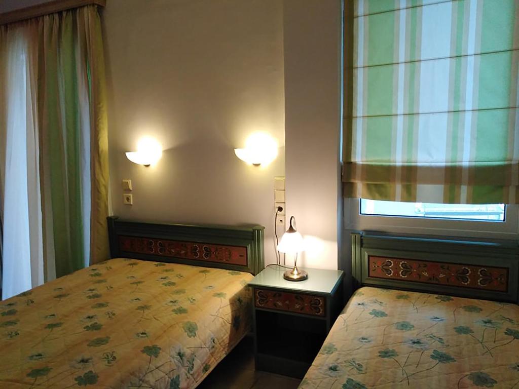 Postel nebo postele na pokoji v ubytování Villa Niki