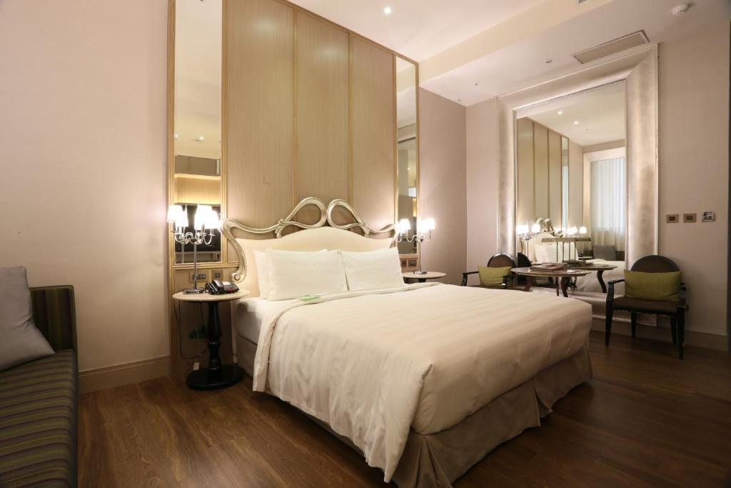 Postel nebo postele na pokoji v ubytování City Suites - Taipei Nandong