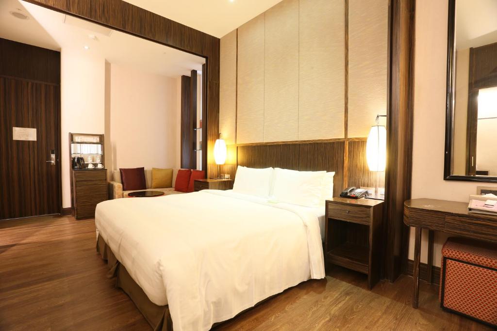 Postel nebo postele na pokoji v ubytování City Suites - Taipei Nandong