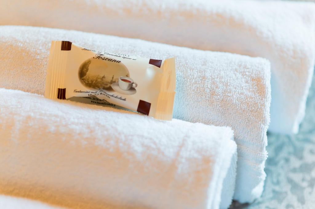 Łóżko lub łóżka w pokoju w obiekcie Il Leccio - casa toscana il fienile