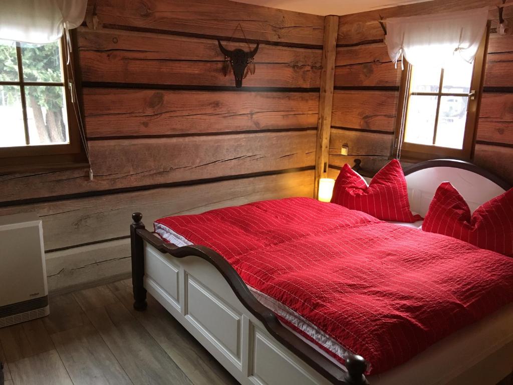 Säng eller sängar i ett rum på CS-Ranchhaus