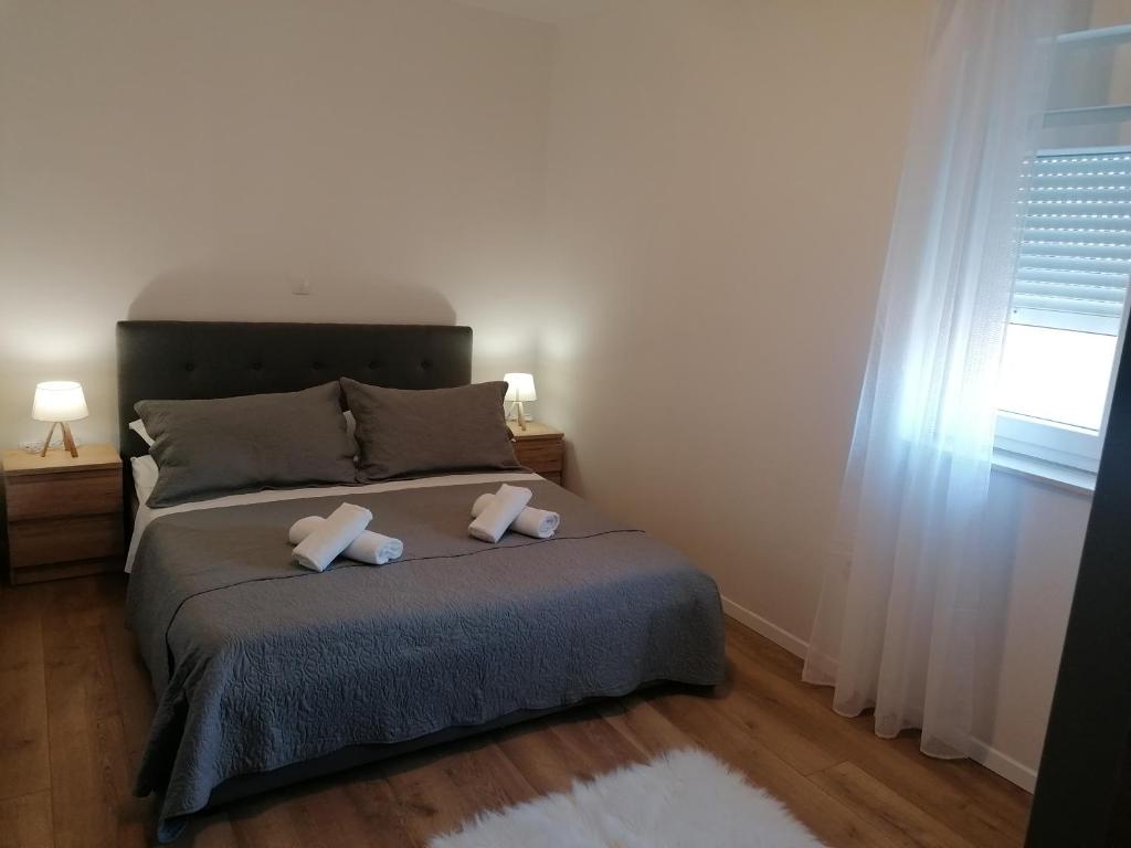 Posteľ alebo postele v izbe v ubytovaní Apartman Bella 2