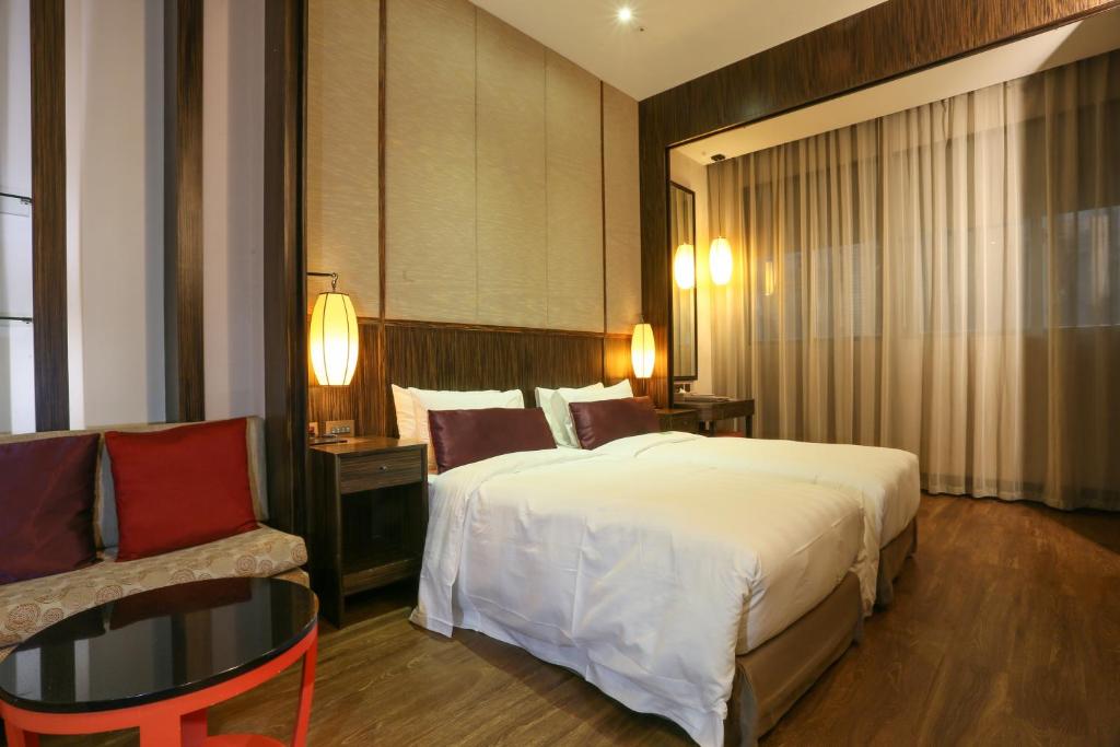 Postel nebo postele na pokoji v ubytování City Suites - Taipei Nandong