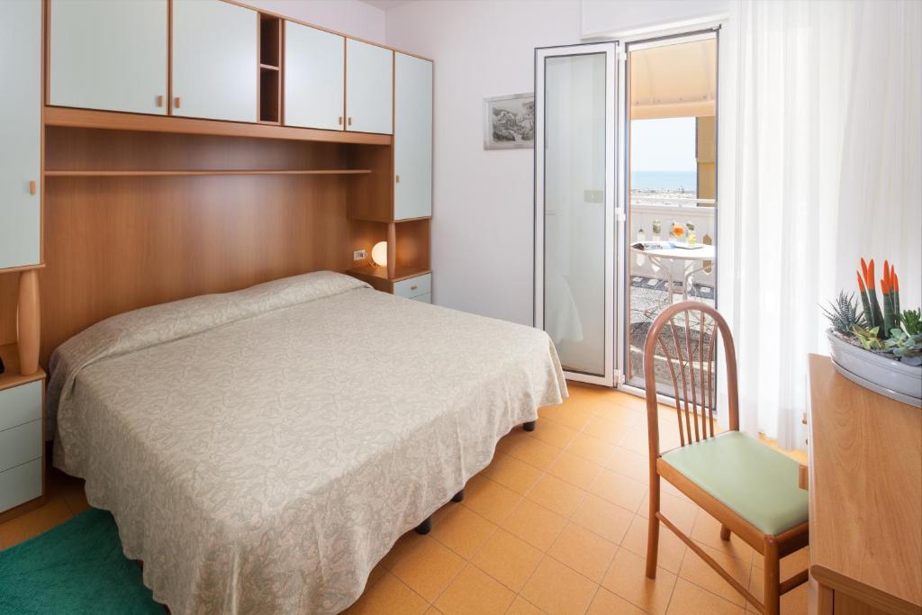 Postel nebo postele na pokoji v ubytování Hotel Universal