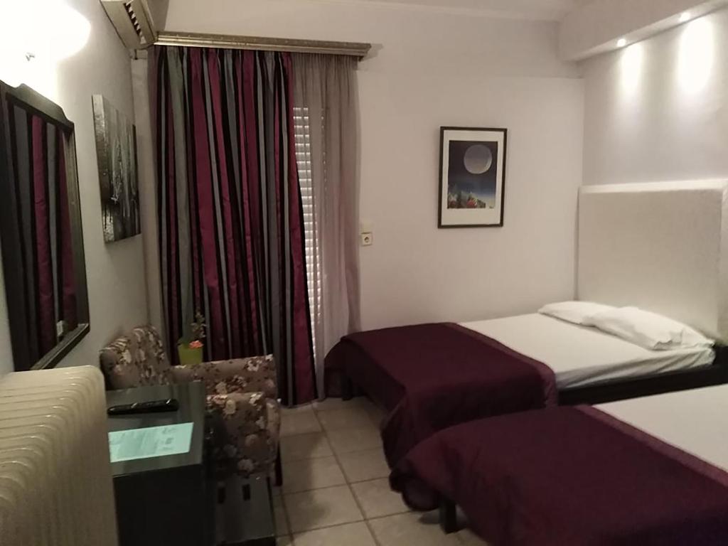 Postel nebo postele na pokoji v ubytování Villa Niki