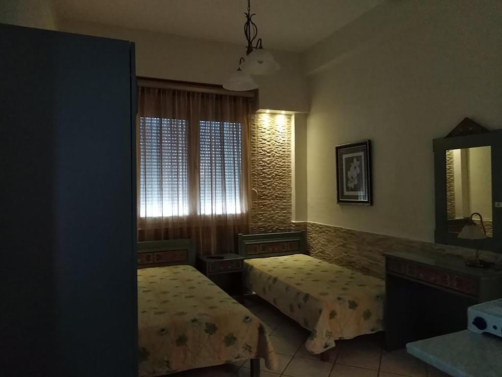 Postel nebo postele na pokoji v ubytování Villa Niki