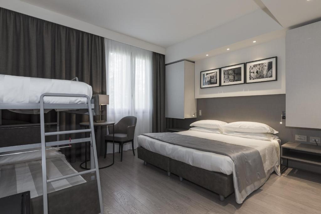 Postel nebo postele na pokoji v ubytování Park Hotel Chianti