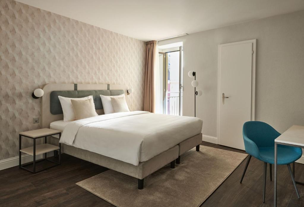 Postel nebo postele na pokoji v ubytování Vista Lakefront Boutique Hotel
