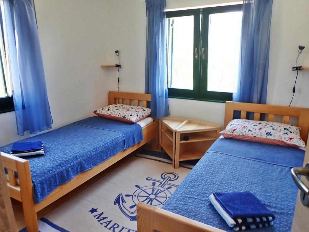 Postel nebo postele na pokoji v ubytování Apartment Adria with seaview