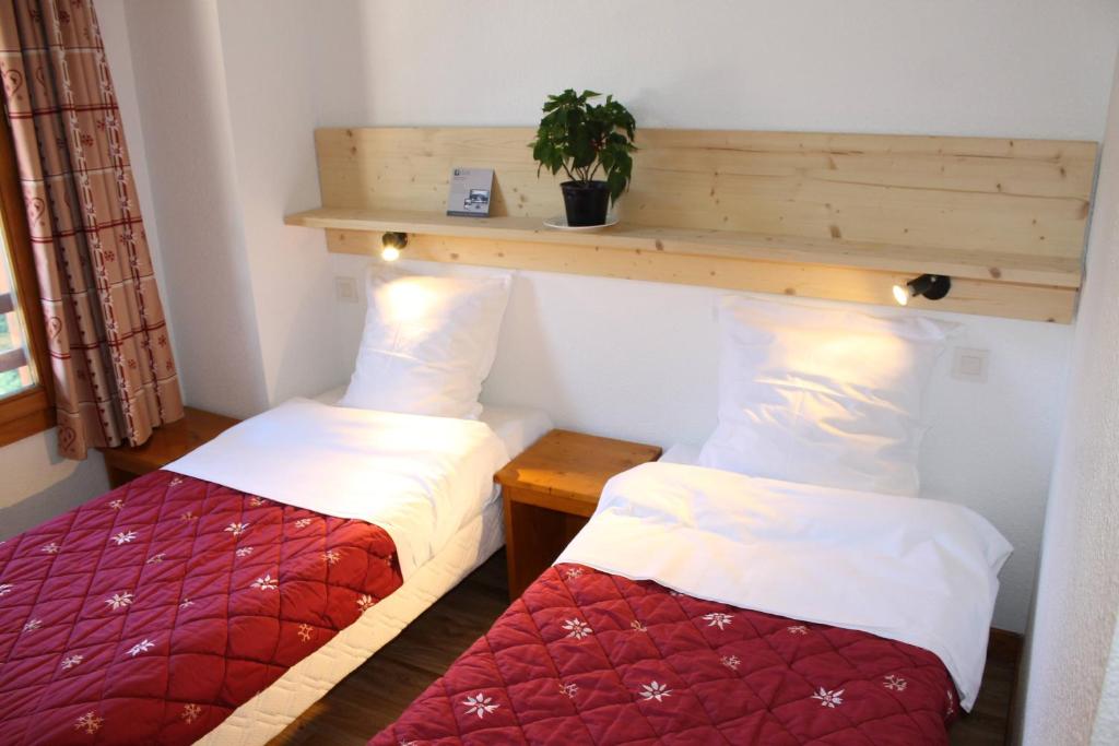 Postel nebo postele na pokoji v ubytování Résidence Saboia B57 Clés Blanches Courchevel