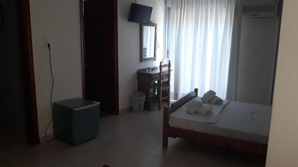 Postel nebo postele na pokoji v ubytování Hotel Lena