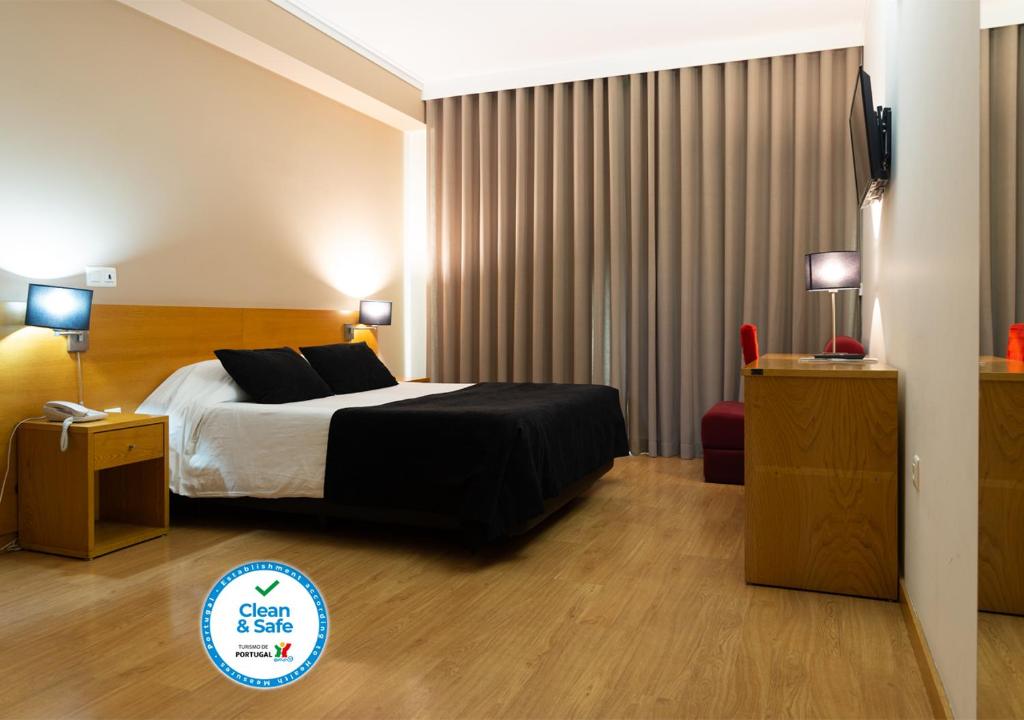 Postel nebo postele na pokoji v ubytování Hotel Durao