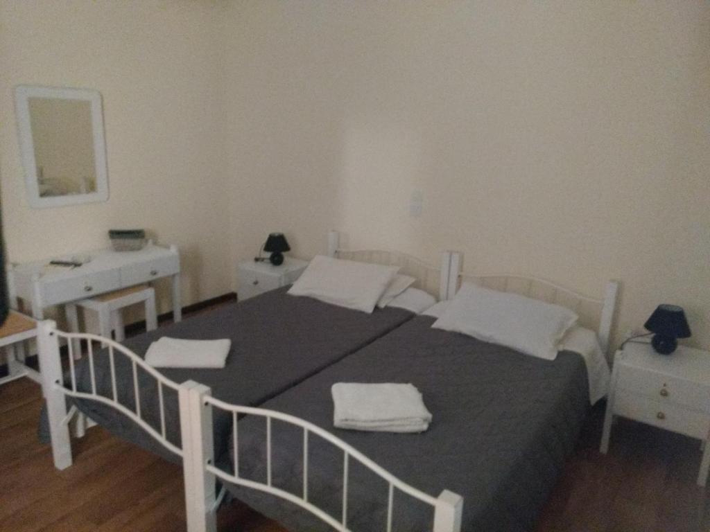 Postel nebo postele na pokoji v ubytování Hotel Διεθνές