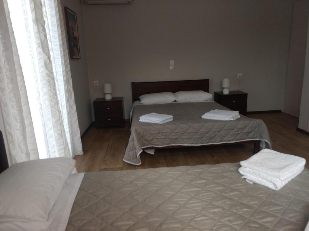 Postel nebo postele na pokoji v ubytování Hotel Διεθνές