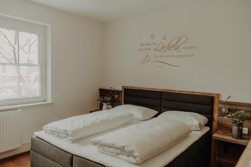 A bed or beds in a room at Jacky's Mühle