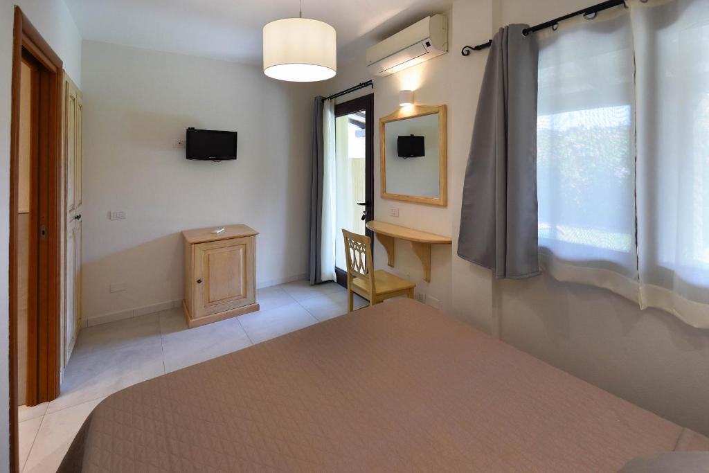 Postel nebo postele na pokoji v ubytování B&B I Graniti Sardi