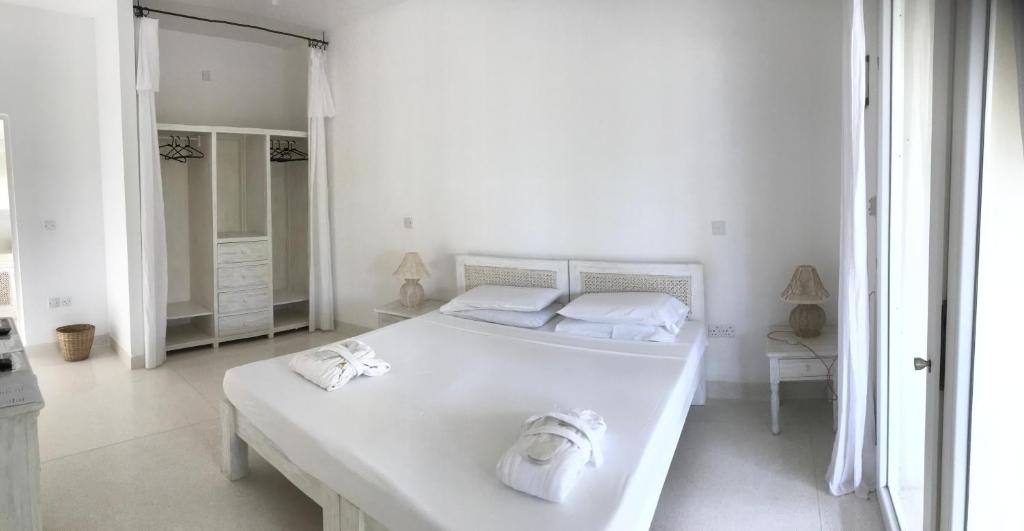 Postel nebo postele na pokoji v ubytování Life Resort St. Thomas Royal Palm