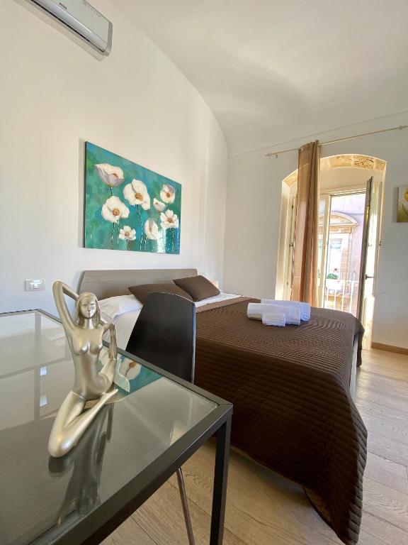 Postel nebo postele na pokoji v ubytování Plaza Rooms