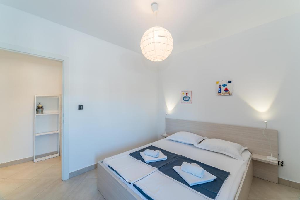 Posteľ alebo postele v izbe v ubytovaní Apartments Keran