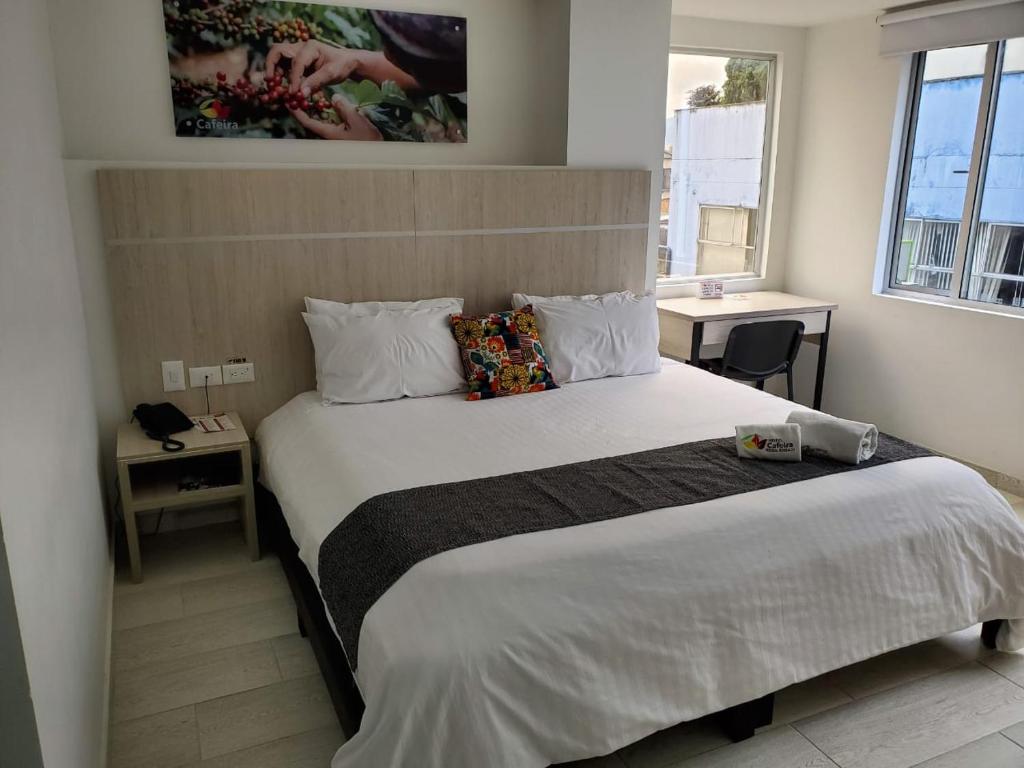 Postel nebo postele na pokoji v ubytování Hotel Cafeira