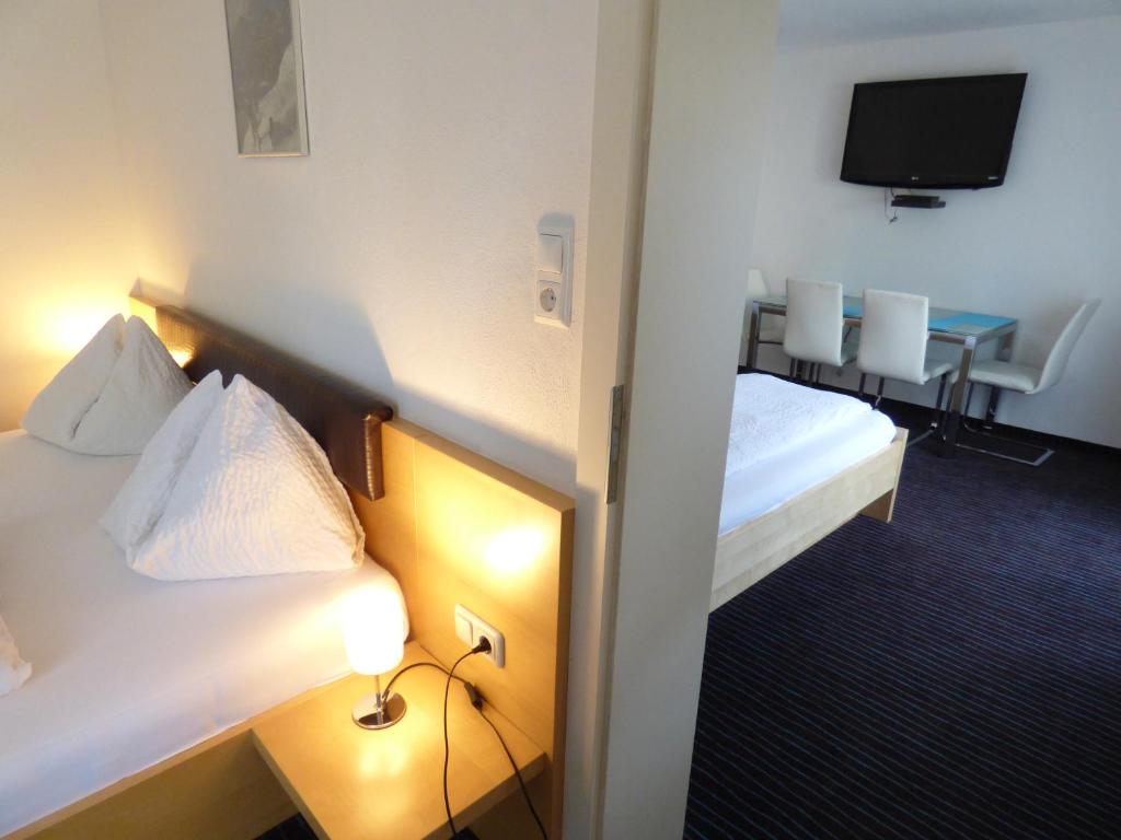 Postel nebo postele na pokoji v ubytování Panoramahotel