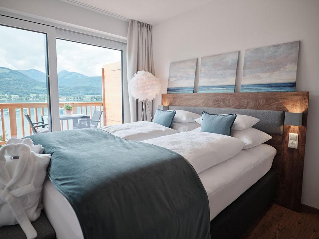 Posteľ alebo postele v izbe v ubytovaní SEE Moment Appartements ADULTS ONLY