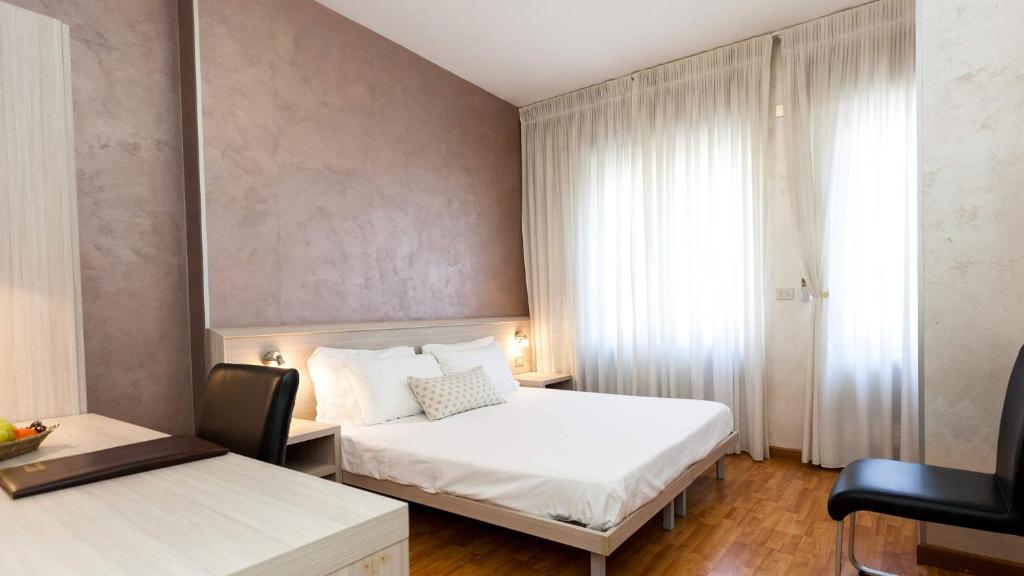 Postel nebo postele na pokoji v ubytování Hotel Lis