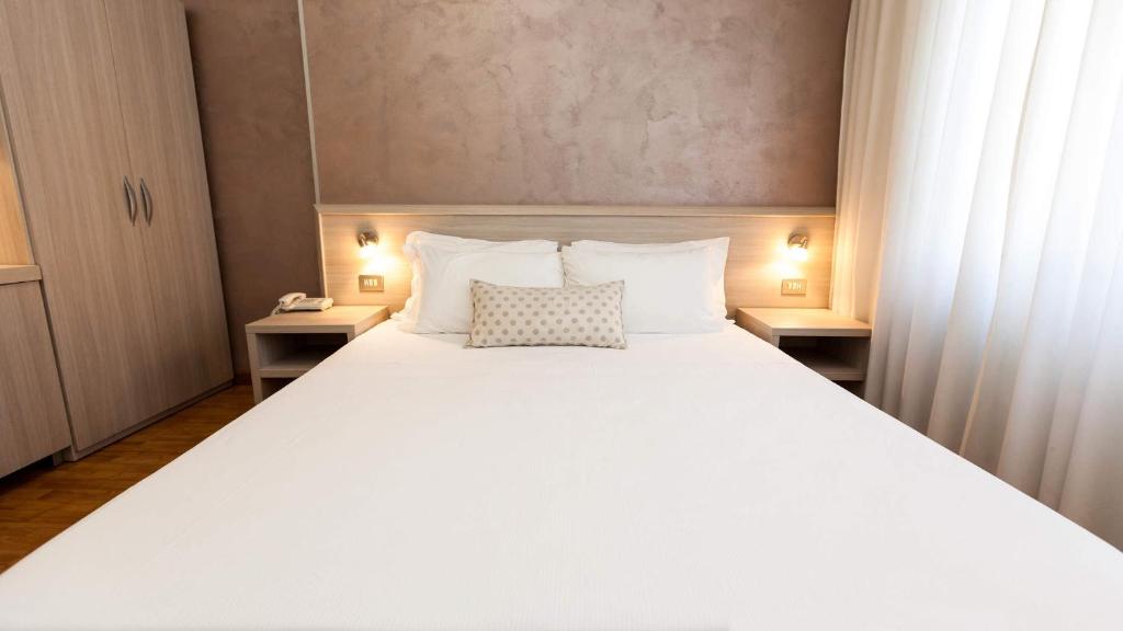 Postel nebo postele na pokoji v ubytování Hotel Lis
