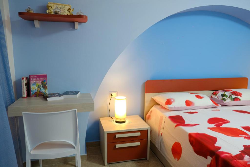 A bed or beds in a room at La Fenice