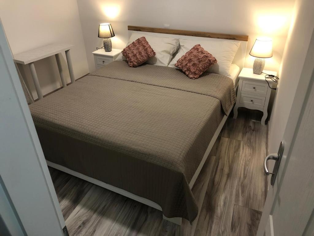 Postel nebo postele na pokoji v ubytování Rooms and Apartments Emily