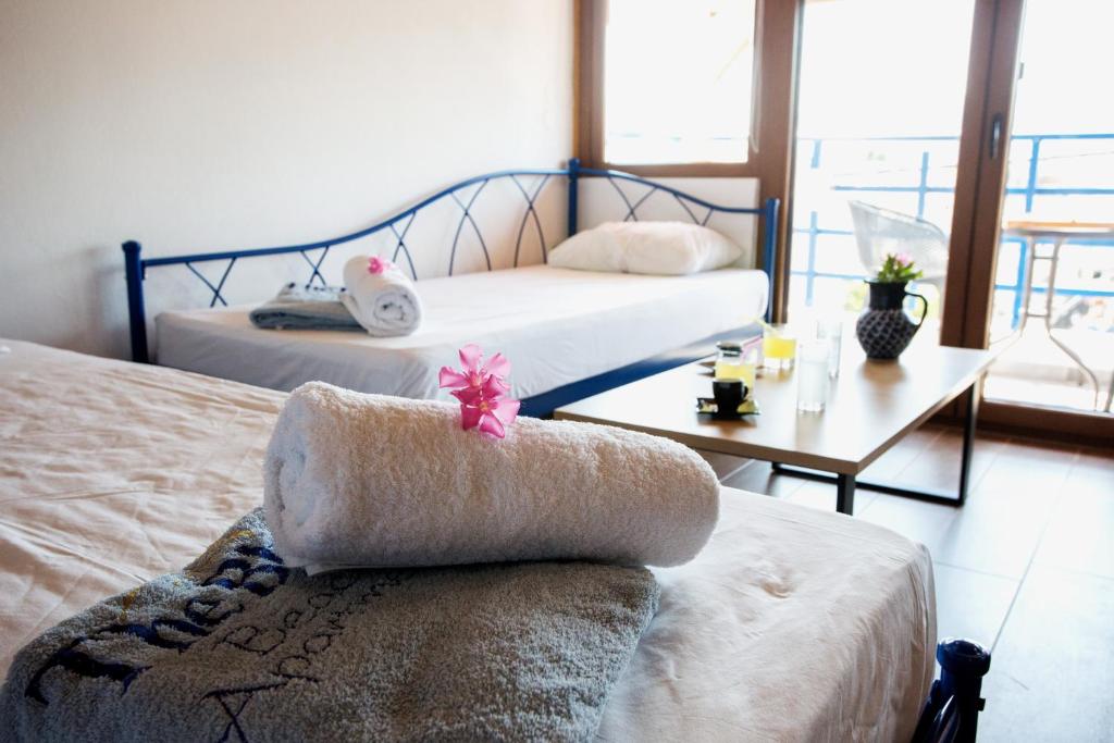 Postel nebo postele na pokoji v ubytování The Blue Beach Apartments