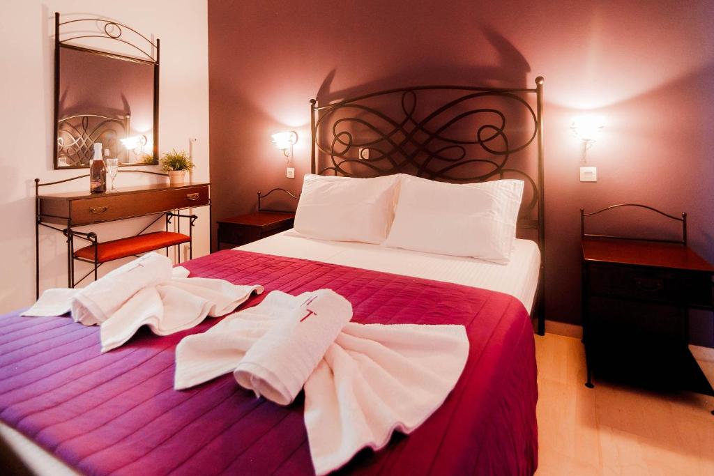 Postel nebo postele na pokoji v ubytování Hotel Torini