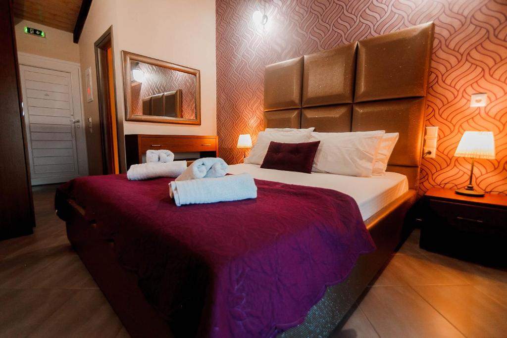 Postel nebo postele na pokoji v ubytování Hotel Torini