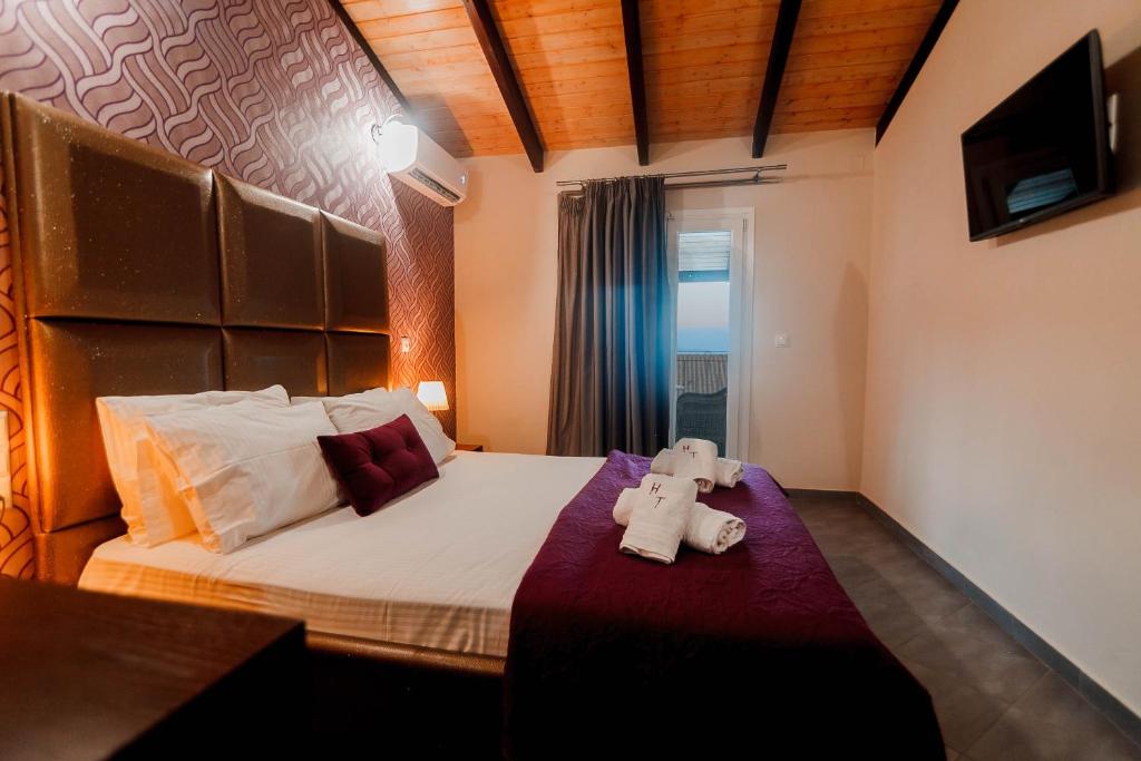 Postel nebo postele na pokoji v ubytování Hotel Torini