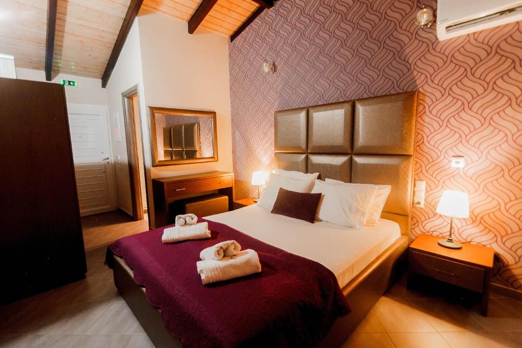 Postel nebo postele na pokoji v ubytování Hotel Torini