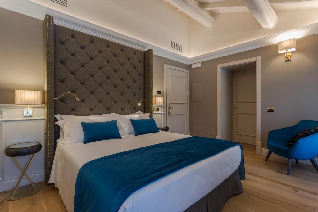 Postel nebo postele na pokoji v ubytování Boutique Hotel Villa Zoppi - Adults only